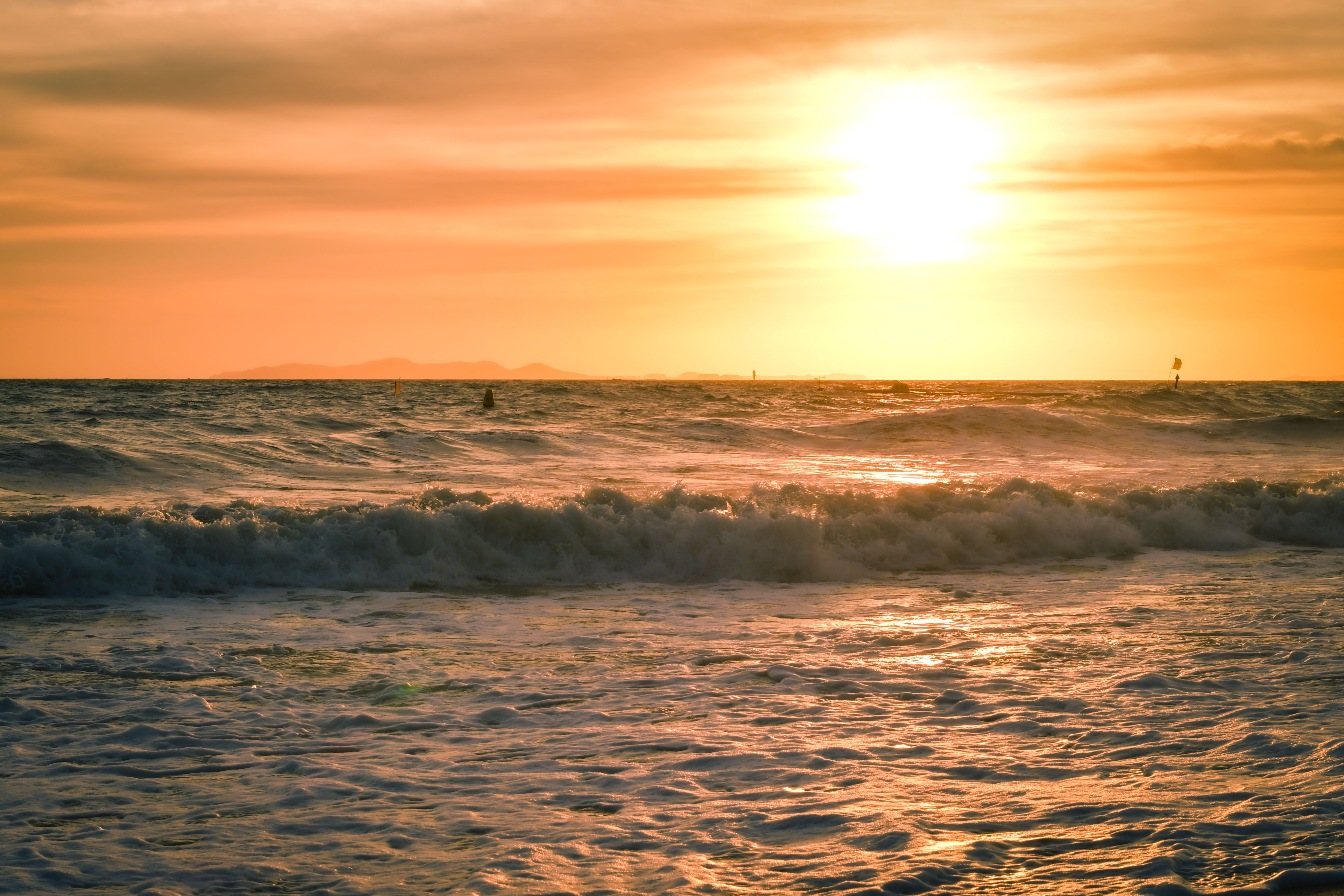Golden Sunset Over Ocean Waves Free Stock Photo