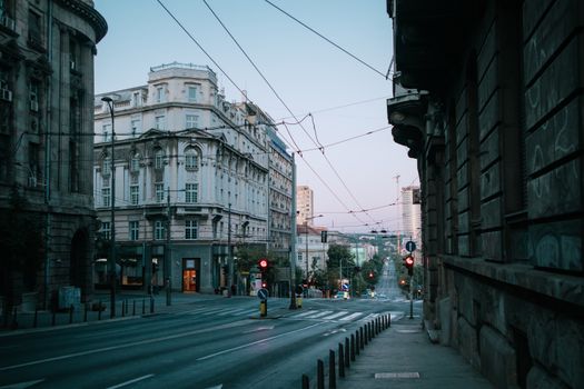 Empty street with historic architecture in twilight showcasing urban tranquility.