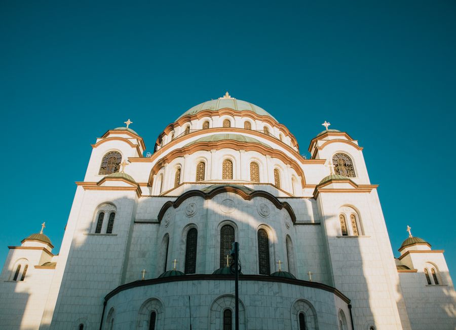 Captivating view of the Temple of Saint Sava under a clear blue sky.