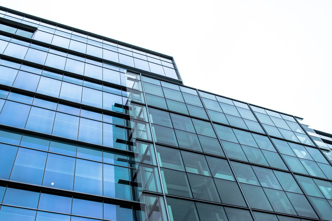 Low-Angle Photograph of a High-Rise Building with Glass Windows · Free ...