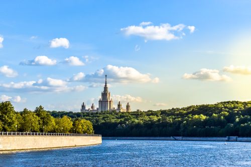 Free View of Moscow State University and the Moscow River under a clear summer sky. Stock Photo