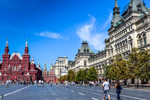 Free Red Square, Moscow captured on a bright day with tourists, historic architecture, and clear skies. Stock Photo