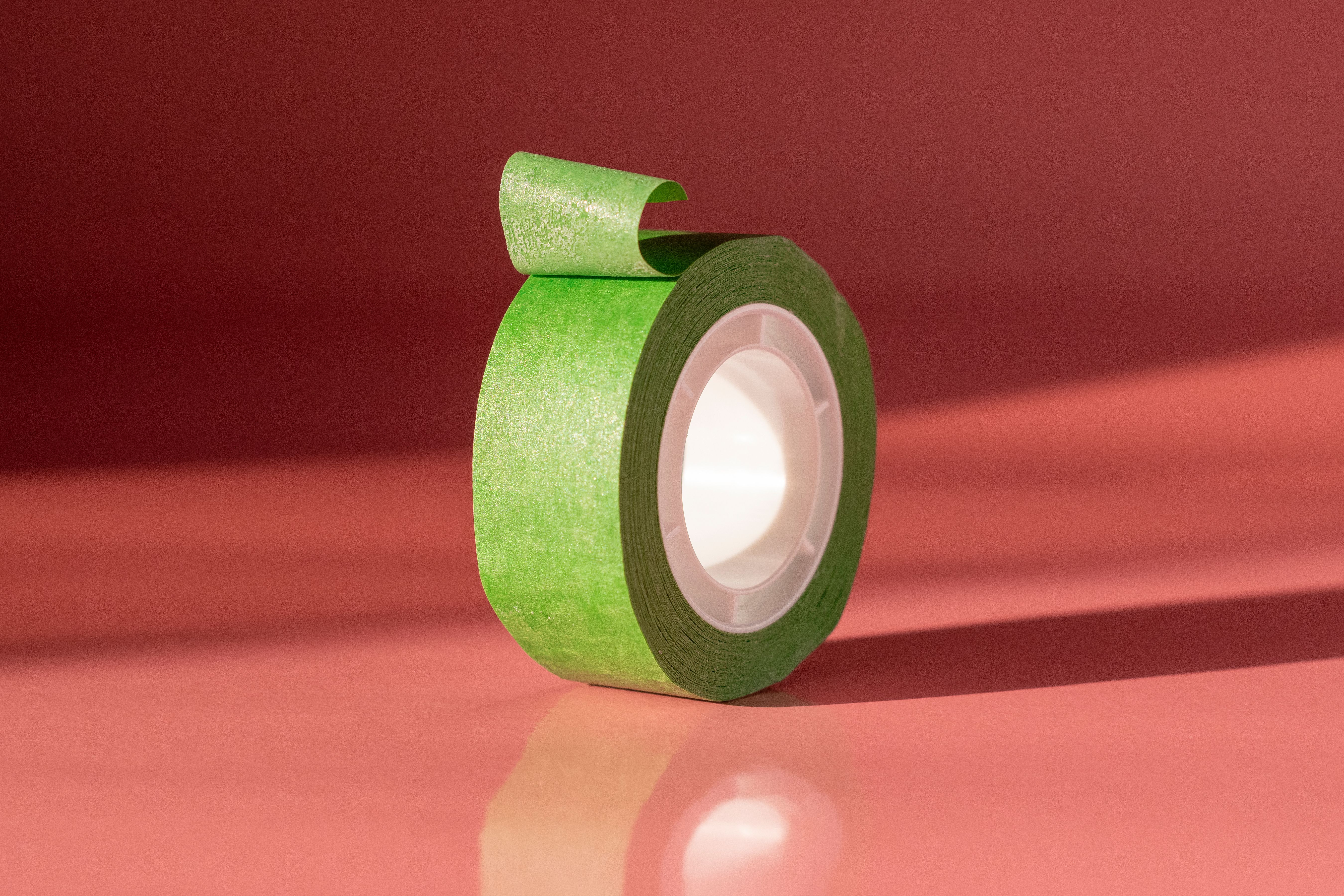 Self-adhesive plates, sheets, film, foil, tape, strip and other flat shapes, of plastics, whether or not in rolls