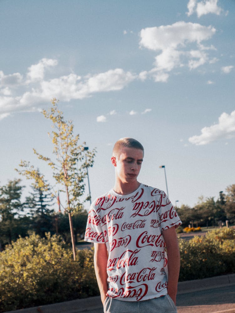 A Man Wearing A Company Branded Shirt