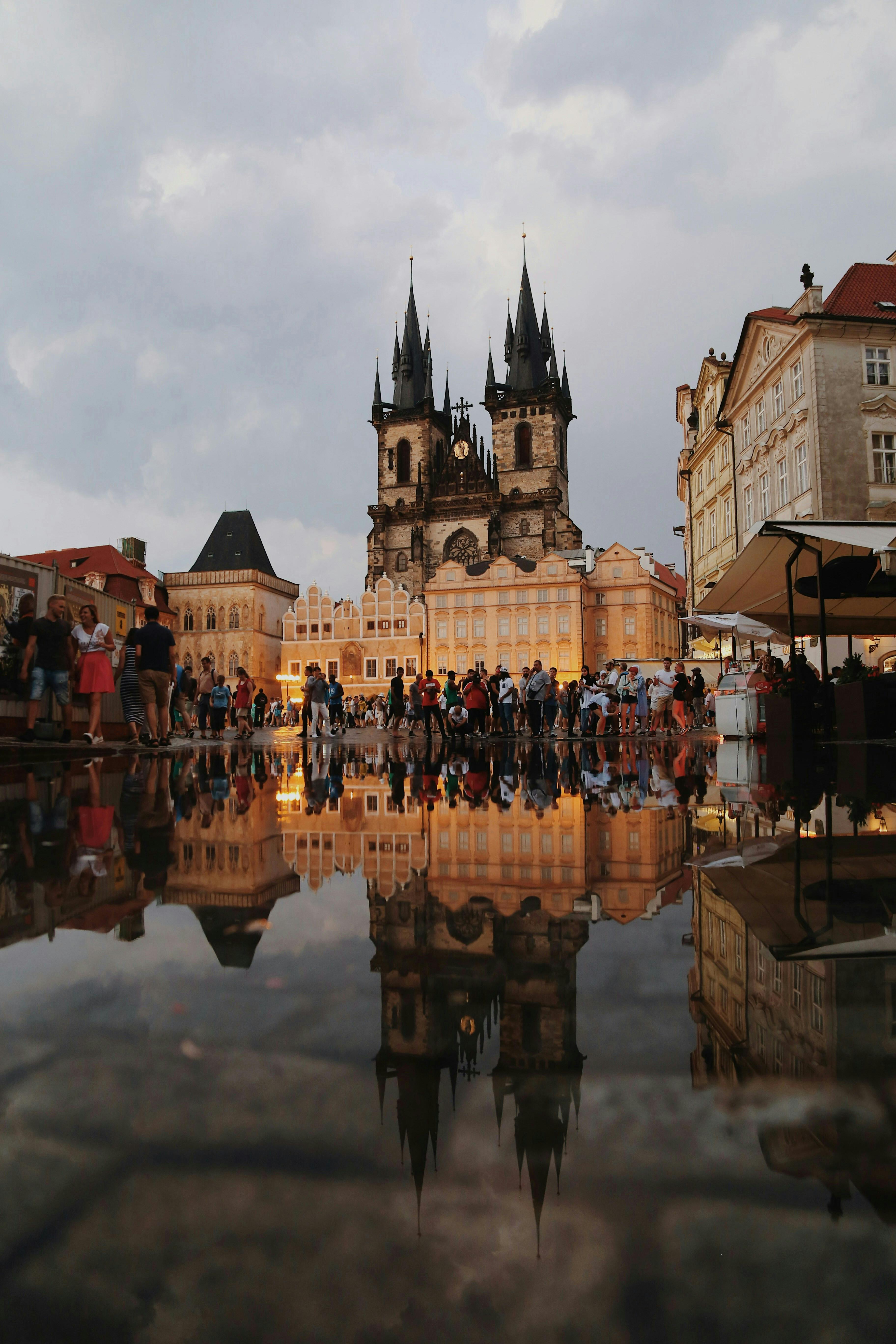 crowd by gothic church in prague old town