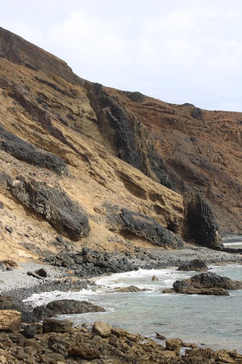 Free Explore the rugged beauty of Porto Santo's rocky coast. Perfect for nature lovers. Stock Photo