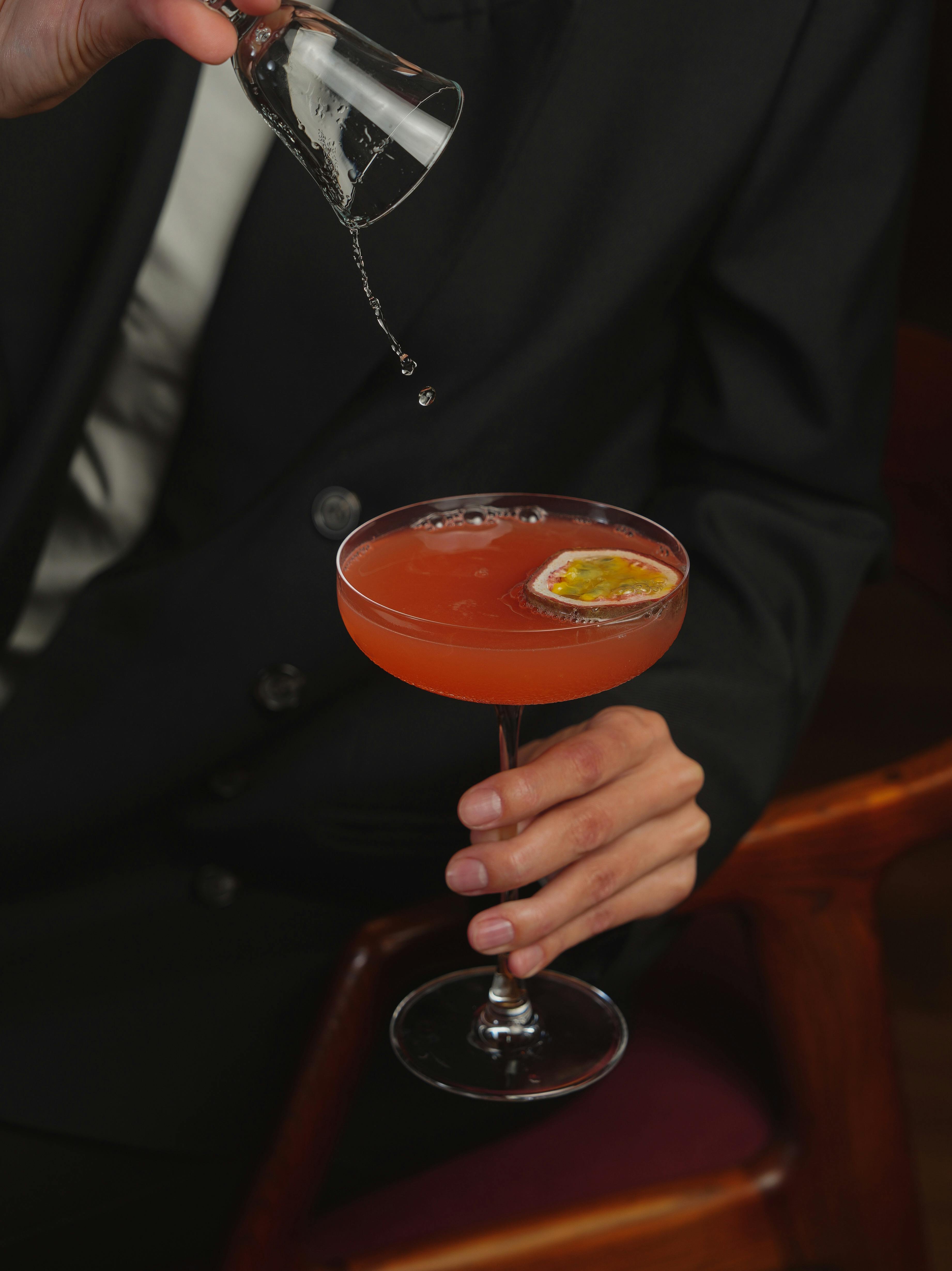 elegant cocktail pouring in sophisticated setting