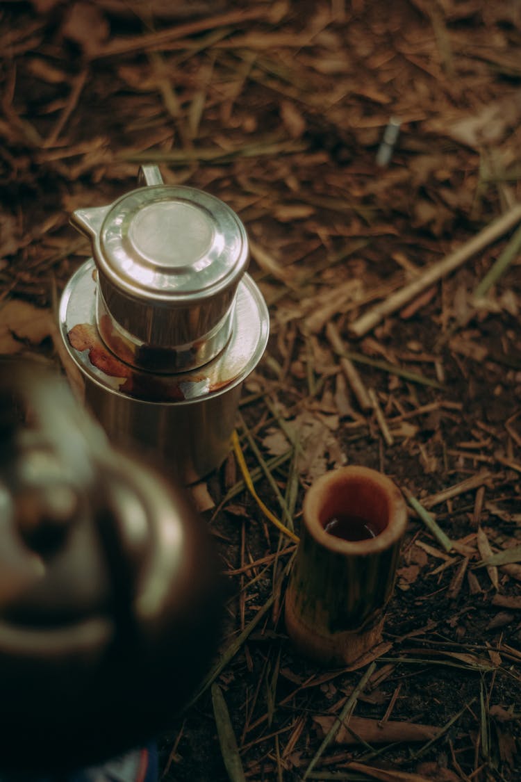 A Silver Pot On The Ground