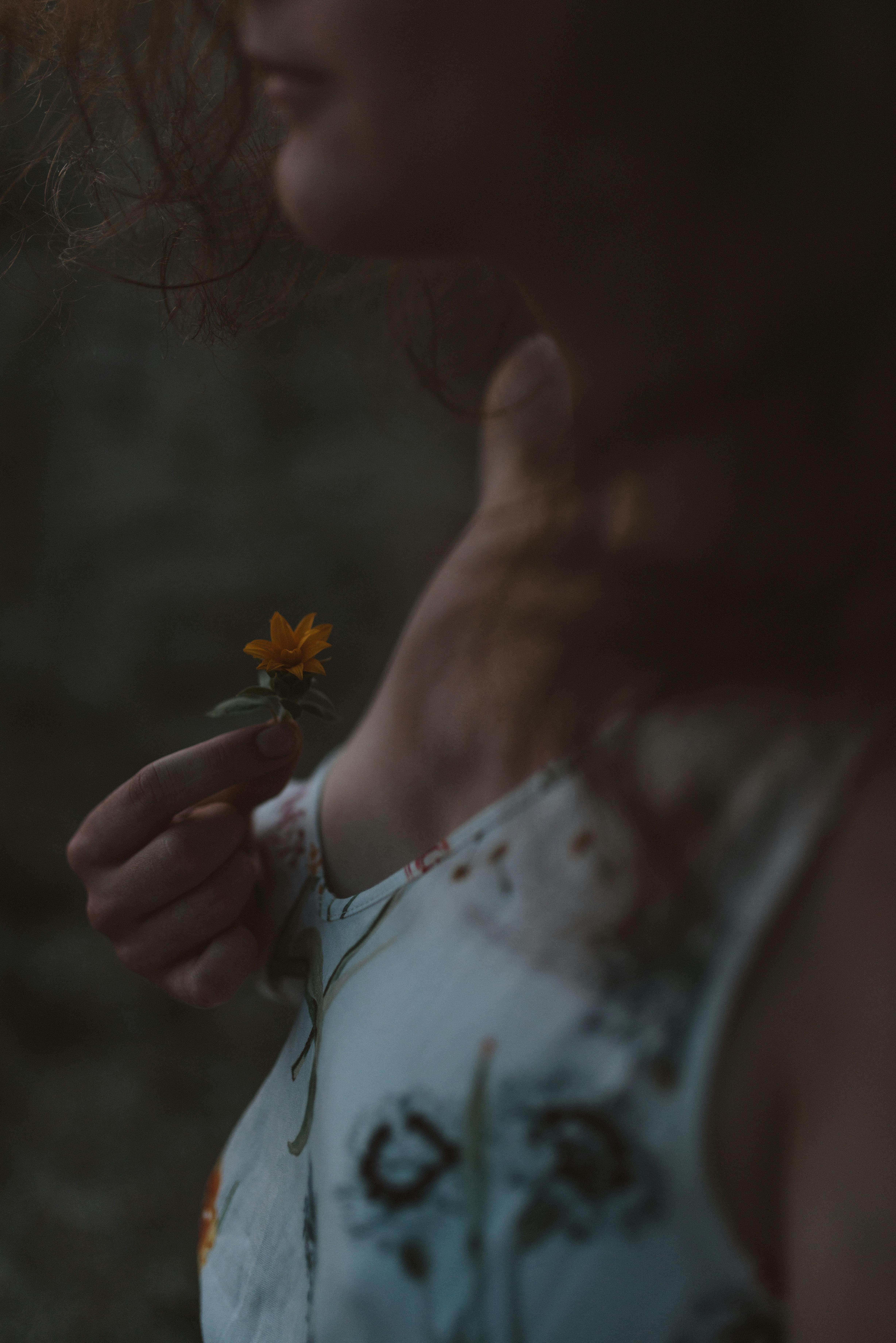 woman holding flower