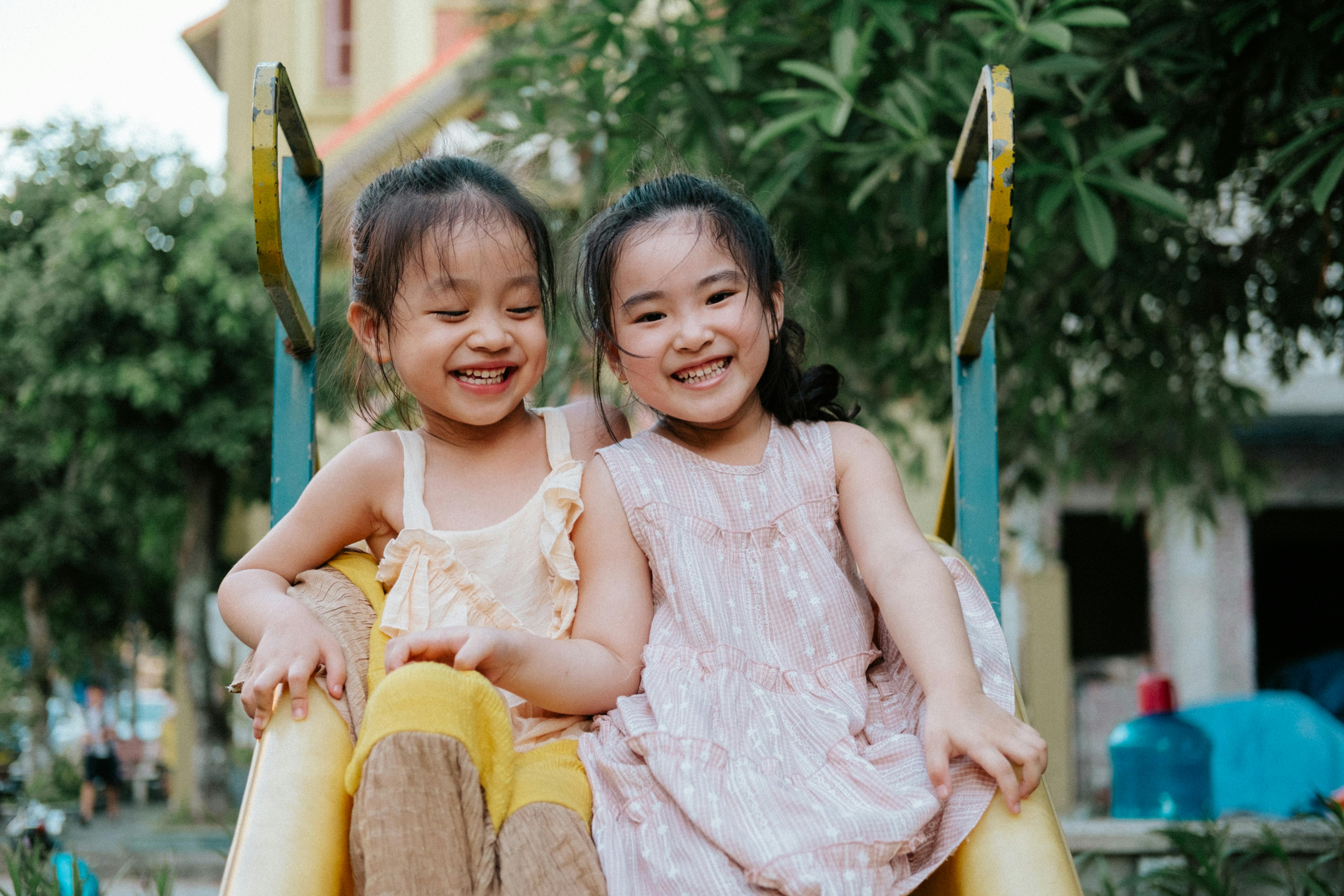 joyful kids sliding outdoors in the park