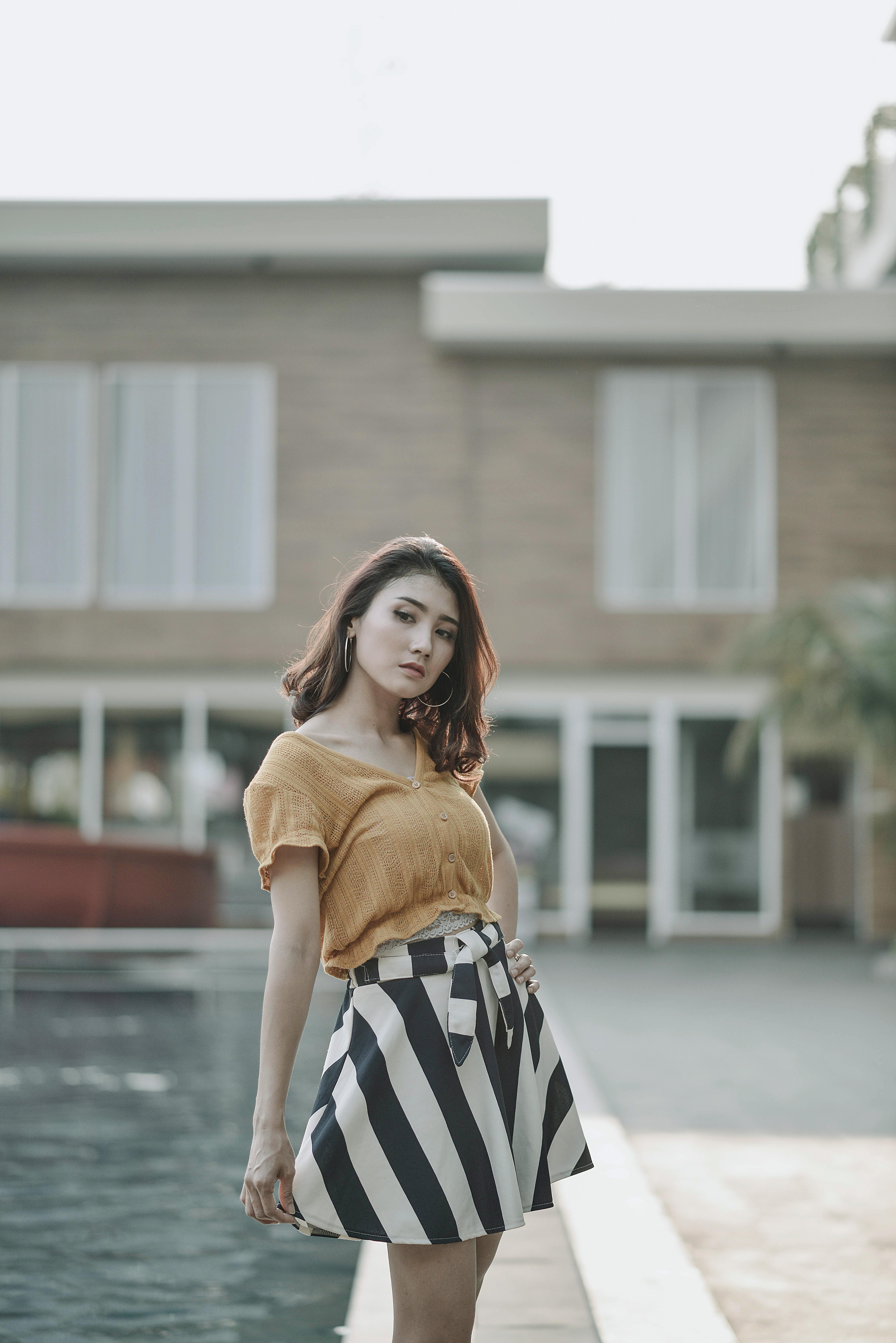 photo of woman wearing yellow top