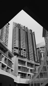 A black and white photo of contemporary skyscrapers showcasing modern urban architecture.