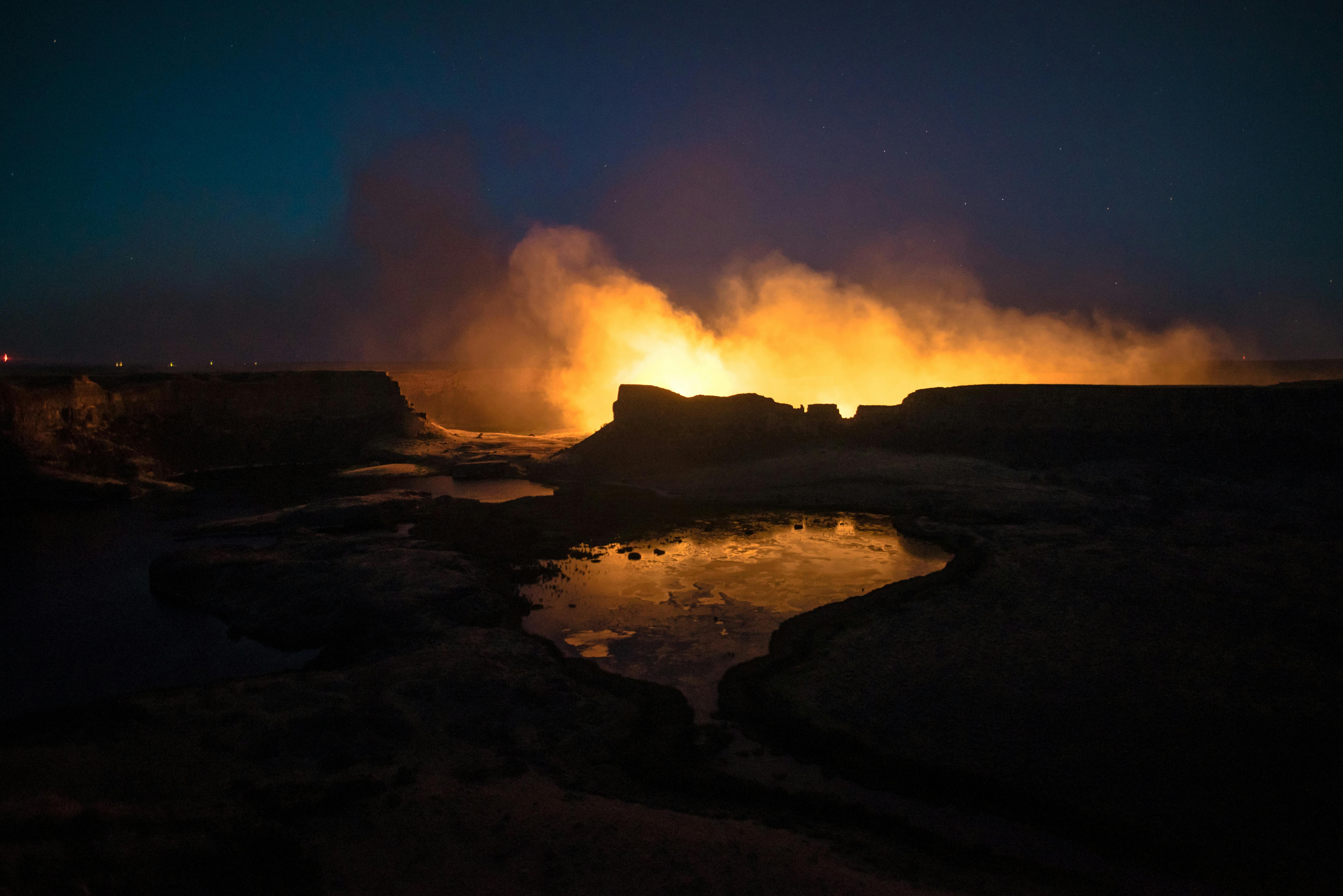 dramatic night view of burning crater