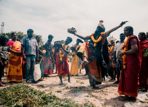 Free A dynamic scene from an Indian religious festival with traditional dance and colorful attire. Stock Photo
