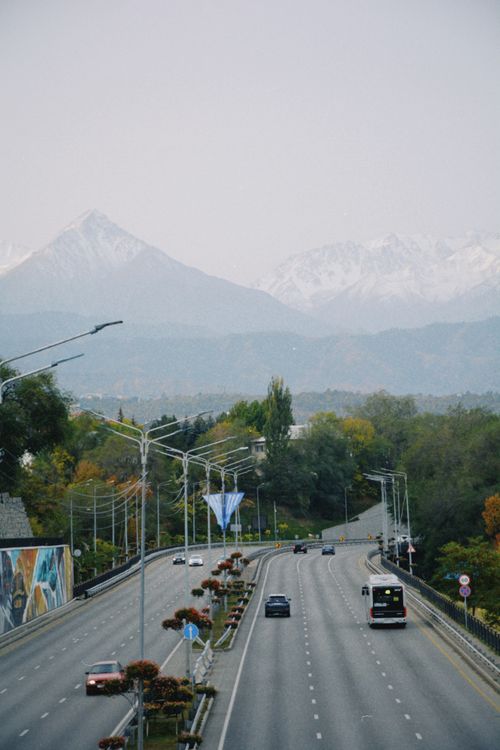 Free Scenic road with mountain view in Almaty, Kazakhstan, showcasing seasonal charm. Stock Photo