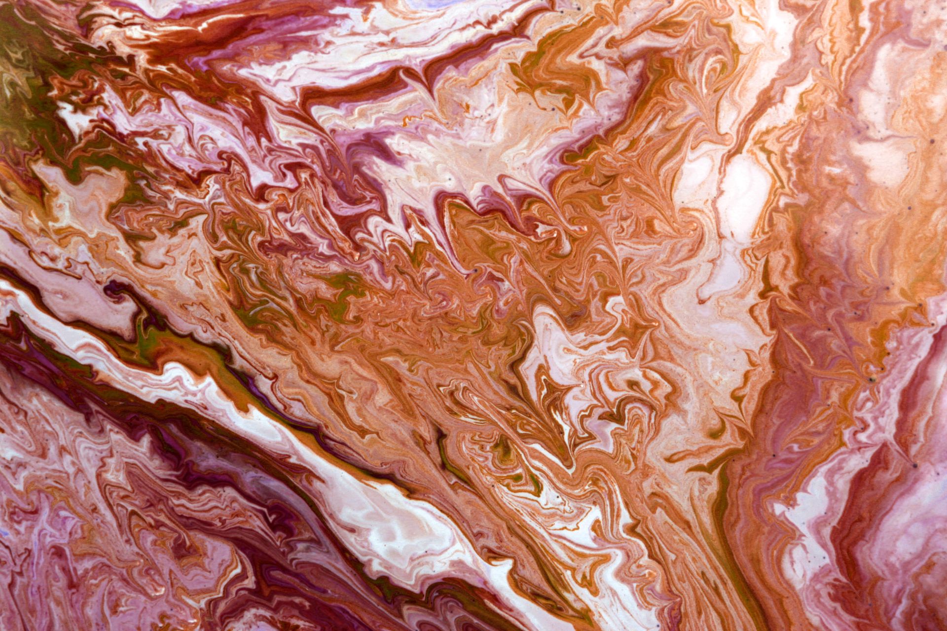 Abstract image featuring swirling patterns of brown and white paint with a marble effect.