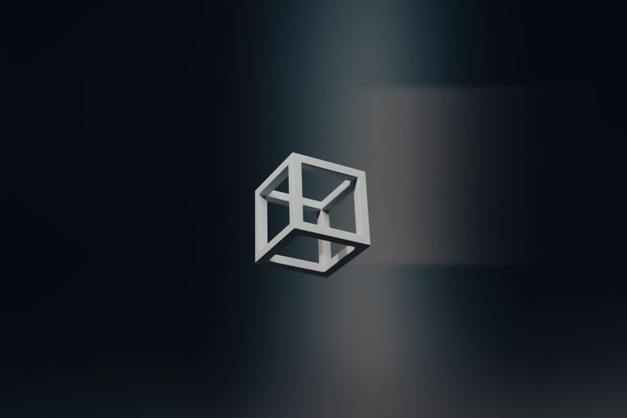 Wireframe cube floating in dark space — photo by Steve A Johnson on Pexels