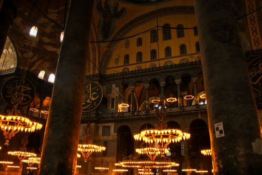 Captivating view of Hagia Sophia's interiors with grand chandeliers and ornate architecture.