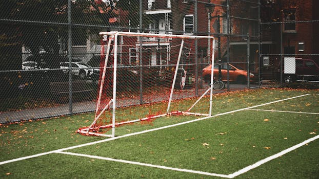 Soccer field with goalpost in Montreal neighborhood during fall season.