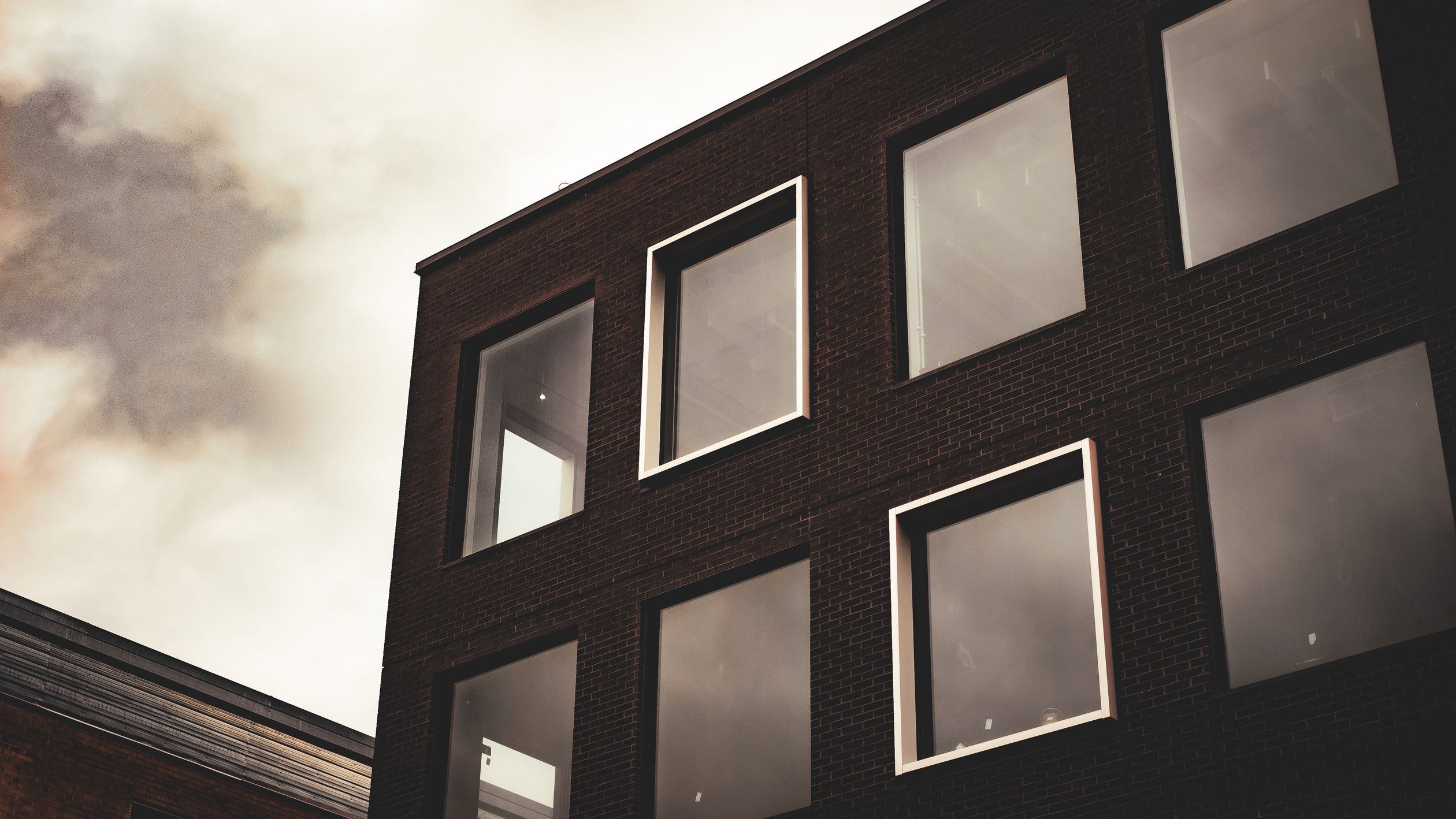 Building Rework Dark Modern Industrial Building with Dark Sky · Free Stock Photo
