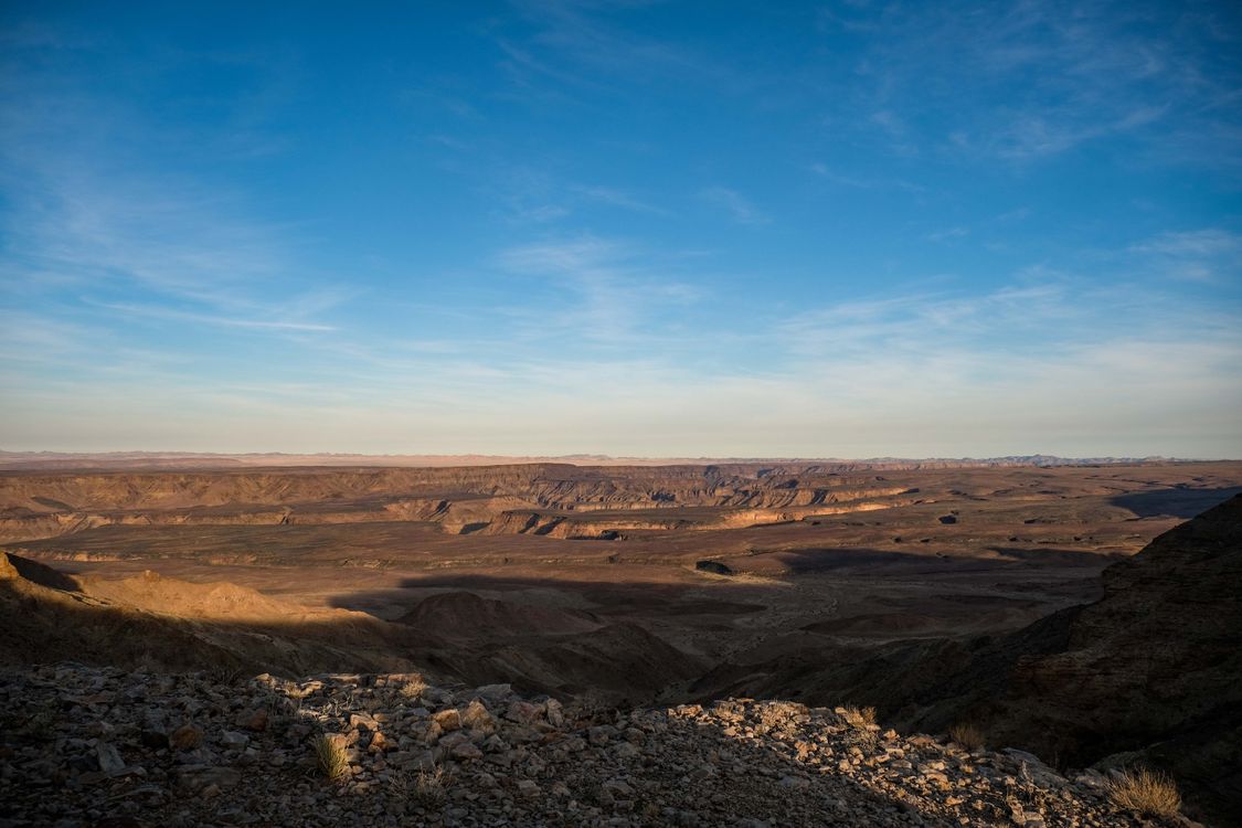 Vast Desert Landscape Under Clear Blue Sky · Free Stock Photo