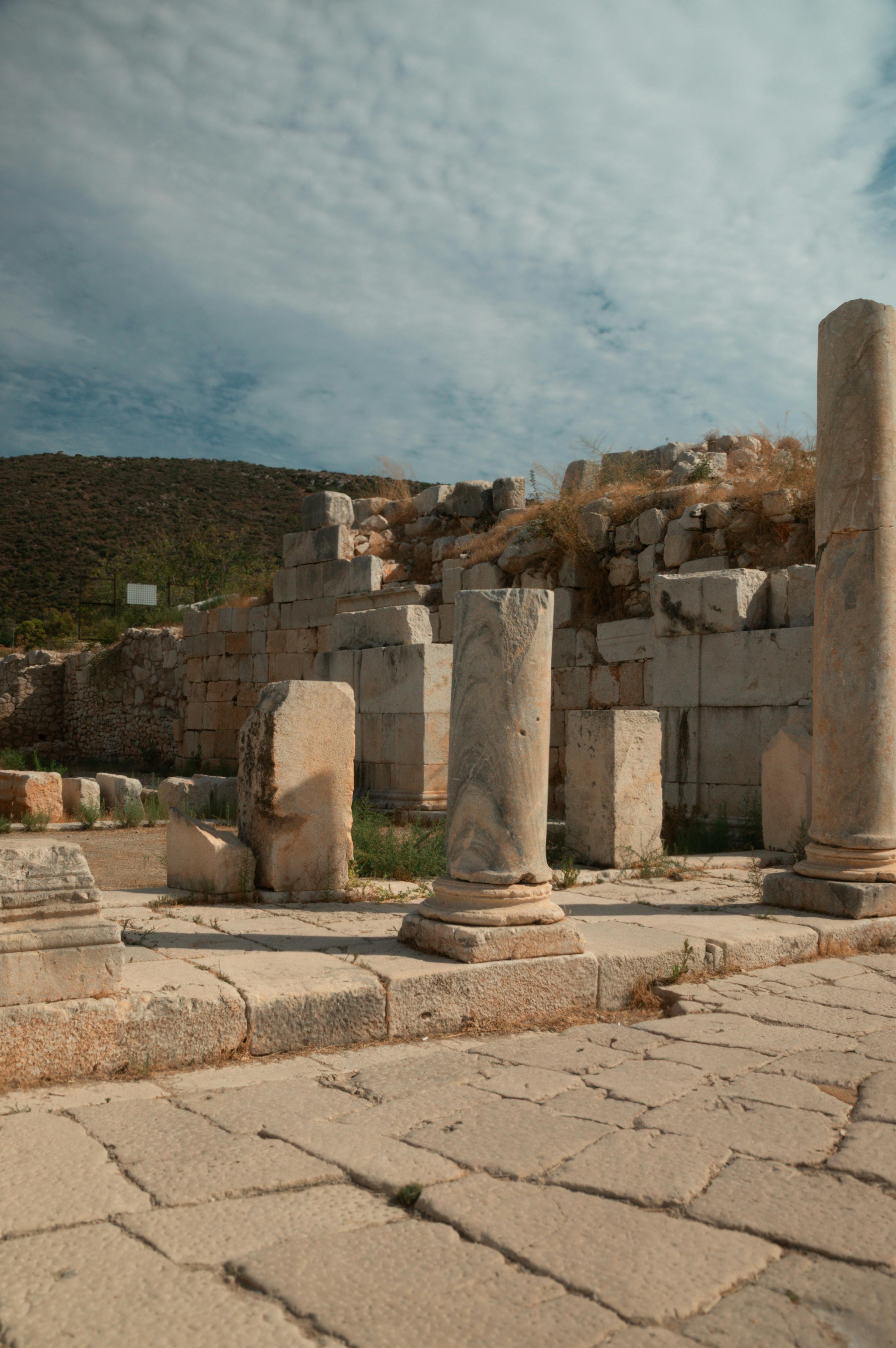 ancient ruins with pillars under blue sky