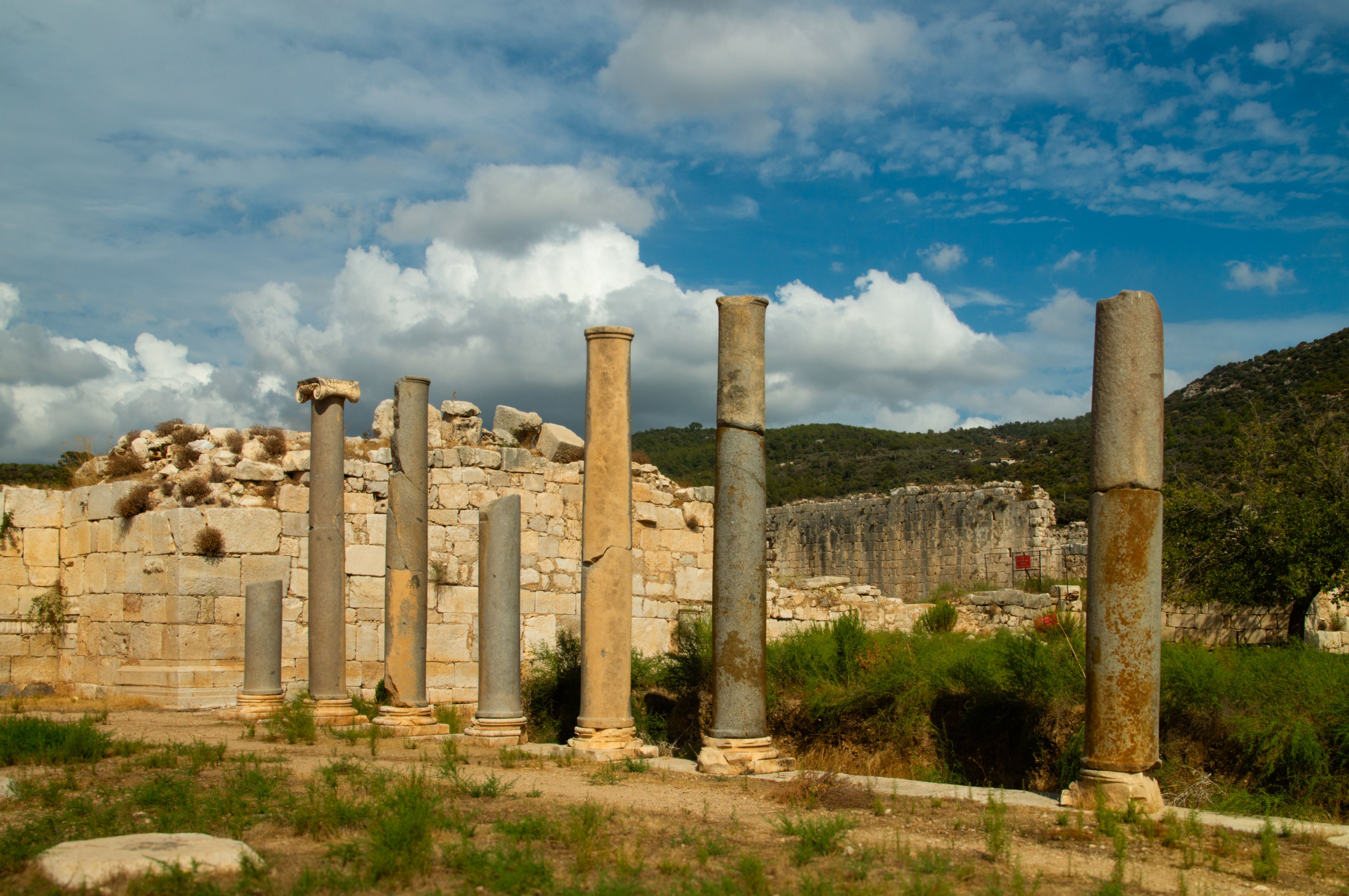 Ancient Ruins with Stone Columns under Blue Sky · Free Stock Photo