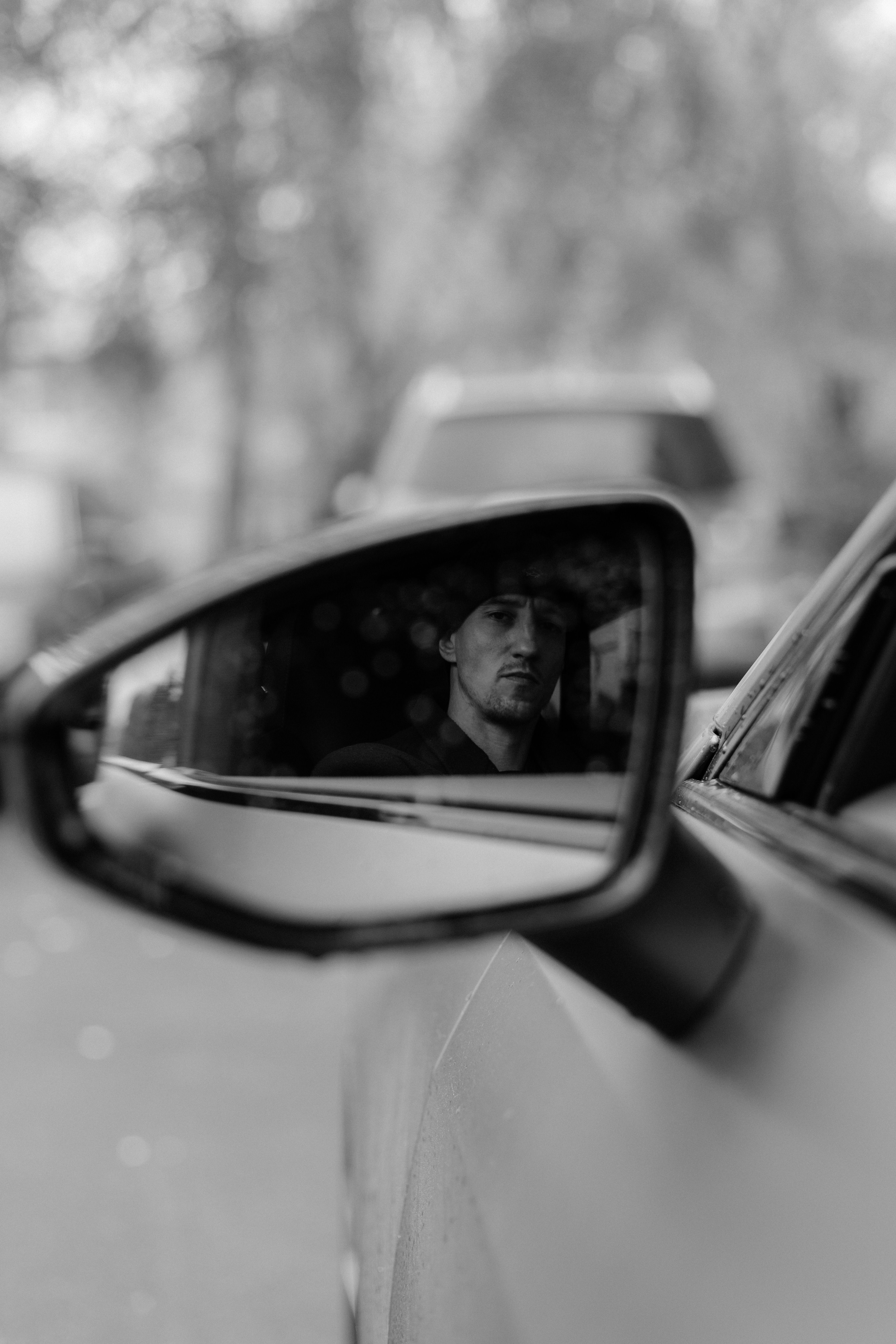 Rearview Mirror Reflection of a Man in Car · Free Stock Photo