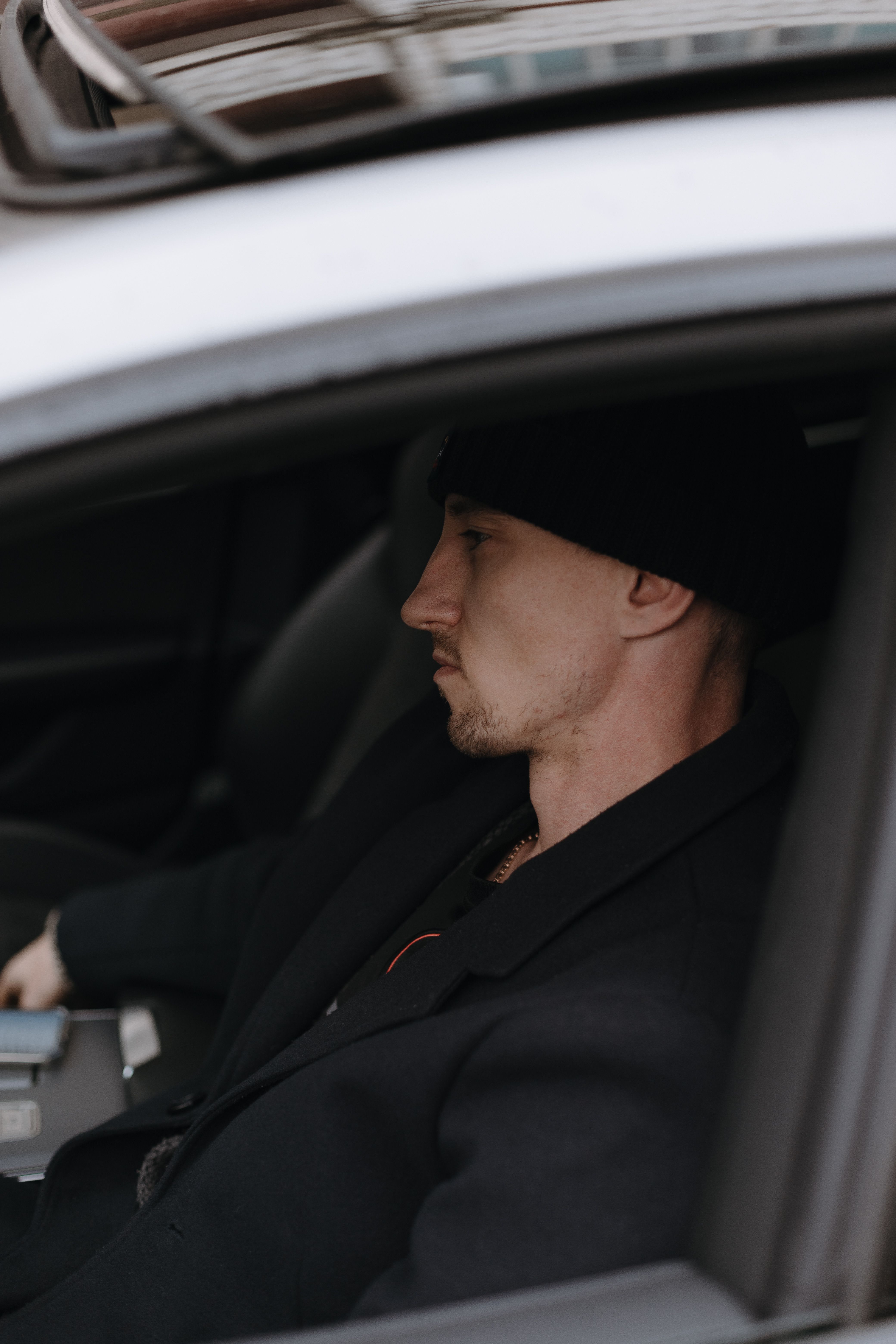 Man Sitting Inside Car Wearing Black Beanie · Free Stock Photo