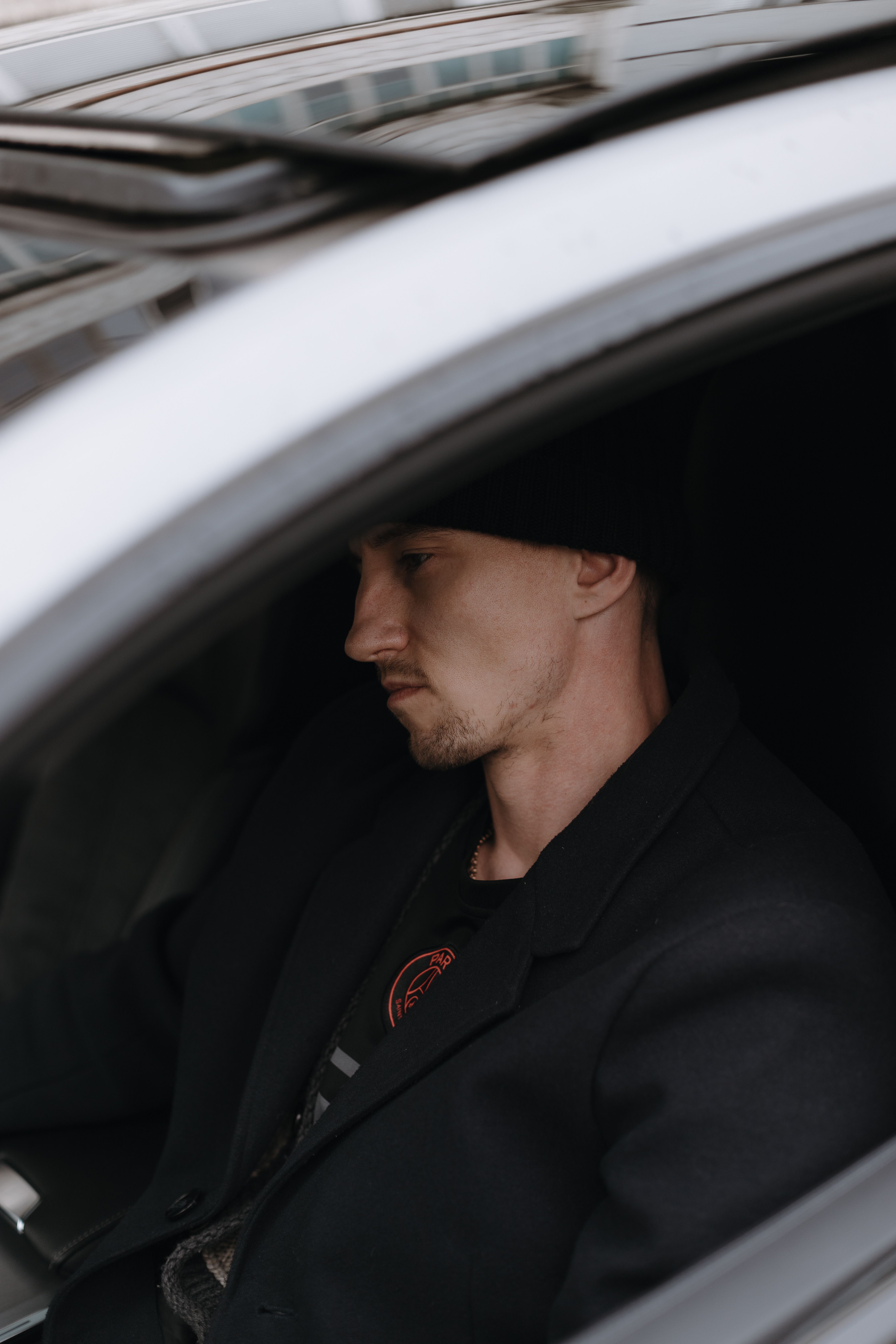 Man in Black Beanie Driving a Car · Free Stock Photo