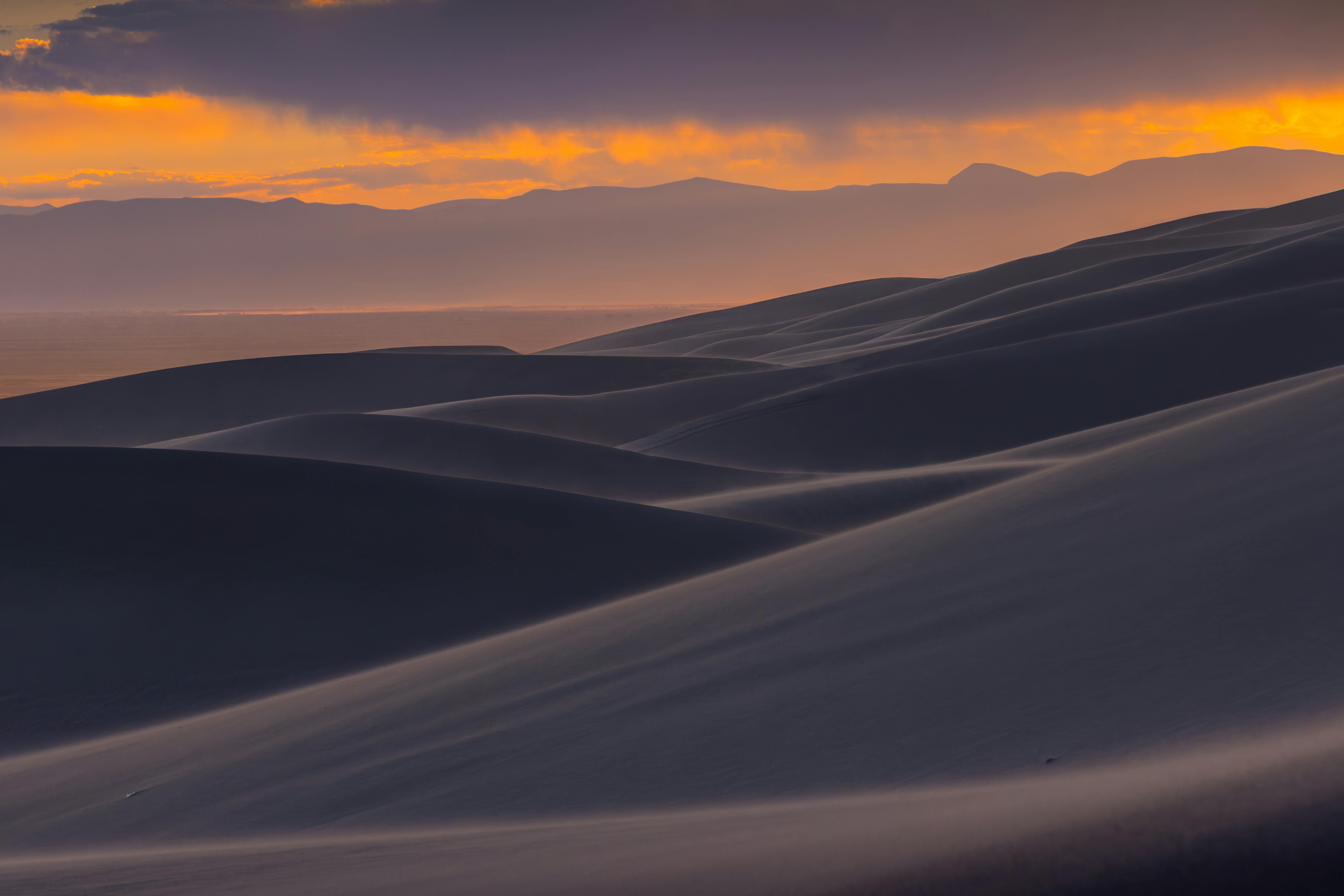 sunset over great sand dunes in colorado