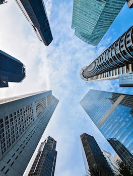 A stunning vertical capture of Singapore's skyscrapers with a blue sky backdrop.