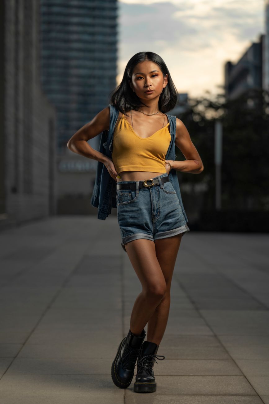 Confident woman in fashionable attire posing in an urban environment. Modern style and grace.