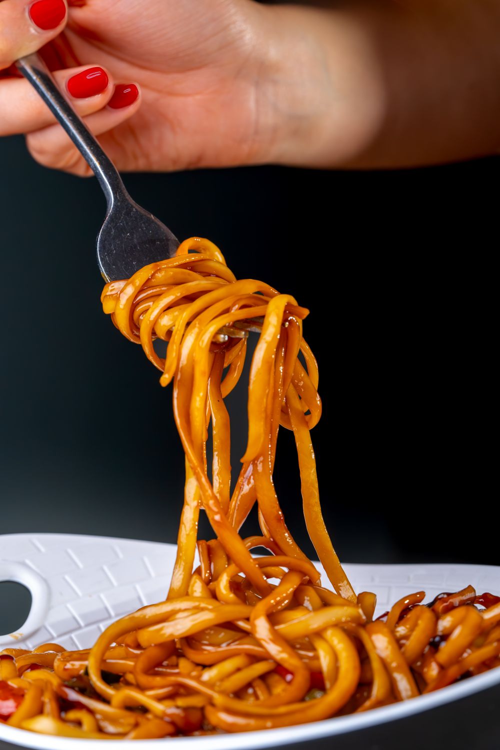 Close-up of Hand Twirling Spaghetti on Fork · Free Stock Photo