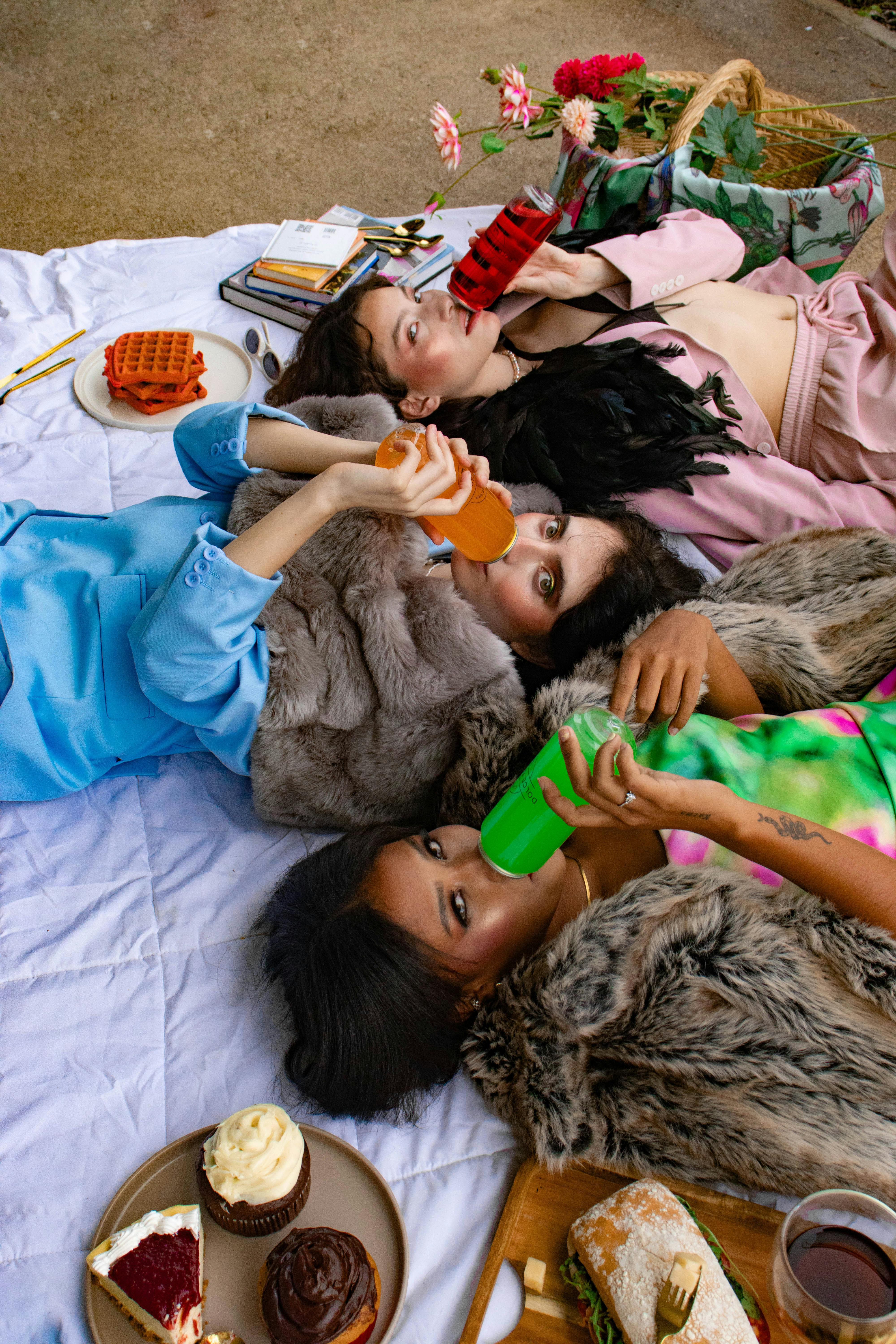 colorful picnic gathering with drinks and pastries