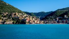 Boccadasse fishing village with pastel houses above a pebble cove