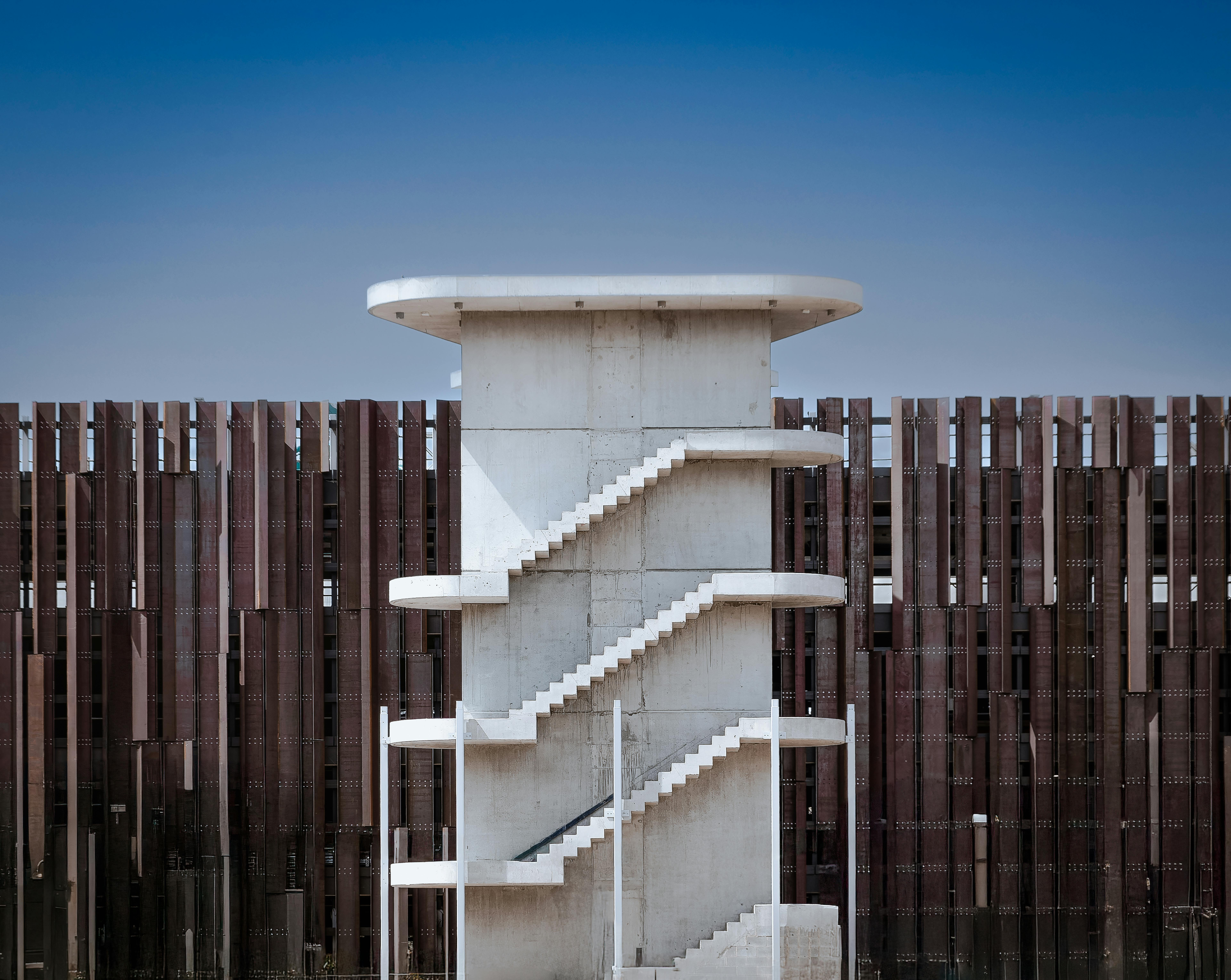 Symmetrical concrete structure outside in Canberra, showcasing minimalism and architectural elegance.