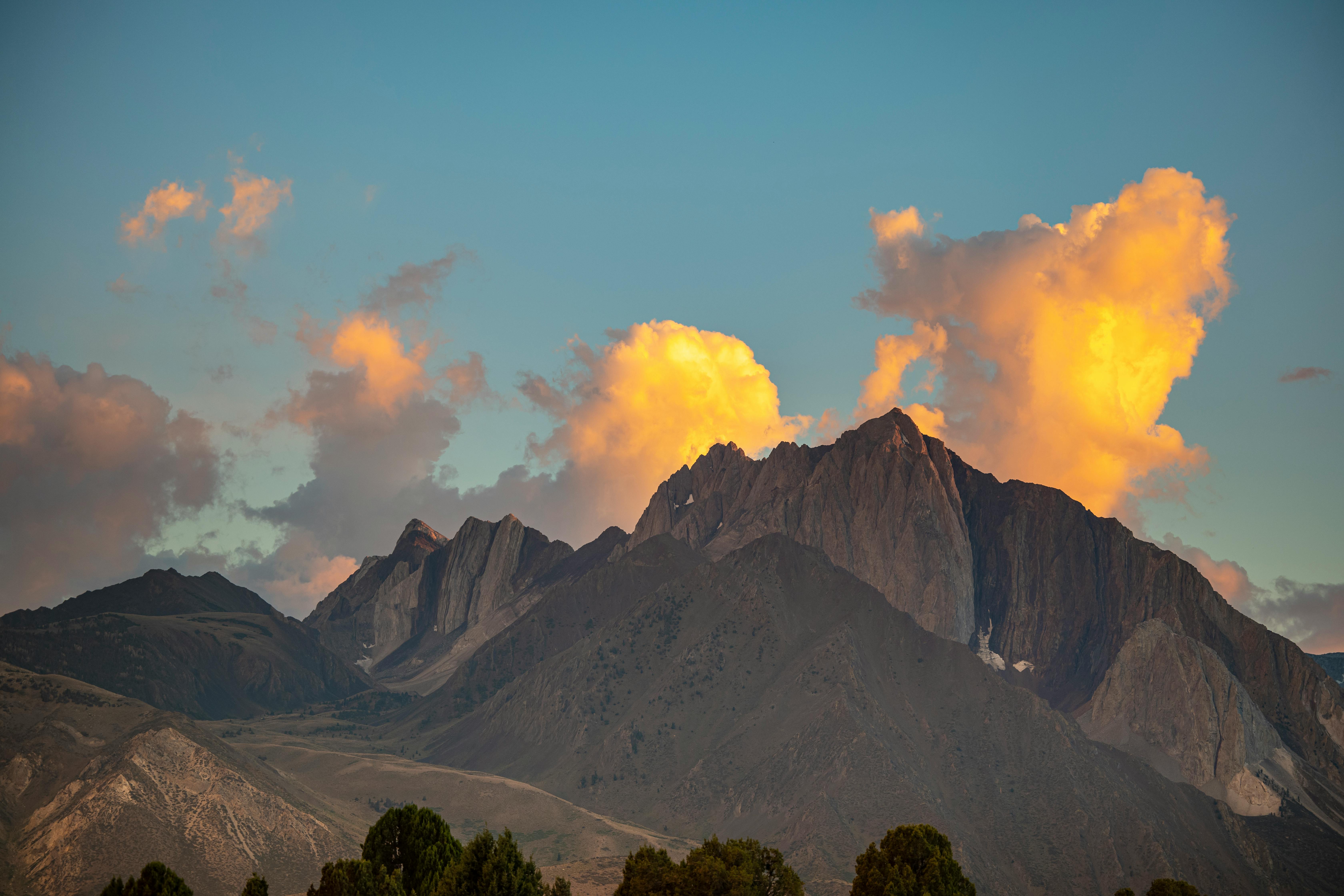 dramatic mountain sunset with clouds