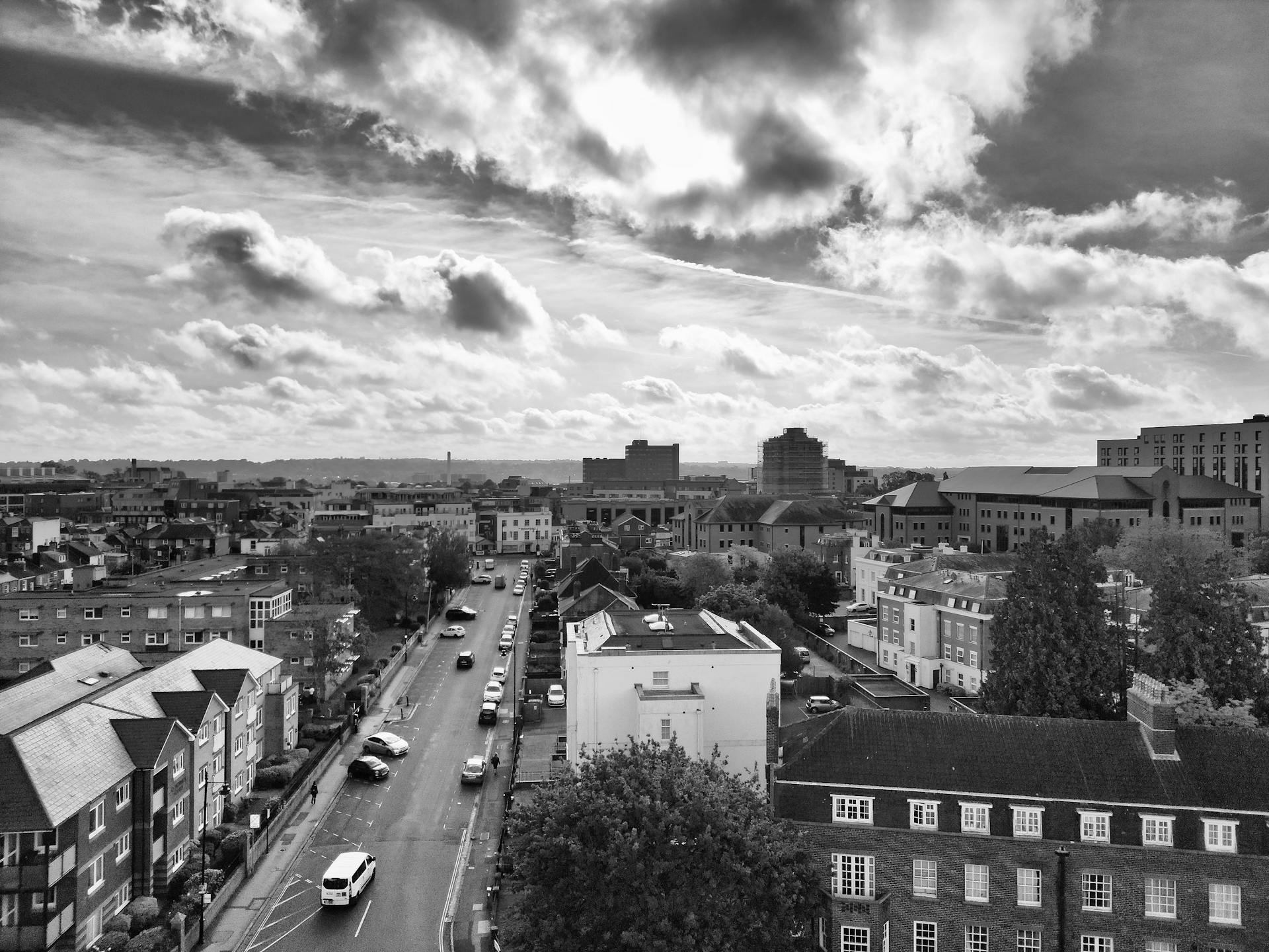 Black and white aerial photograph of a busy street in Southampton with dramatic cloud formations.