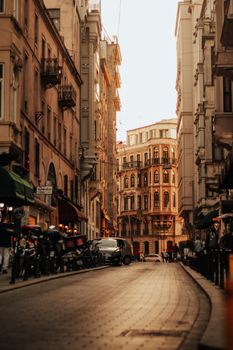 A picturesque street in Istanbul showcasing classic Ottoman architecture at sunset.