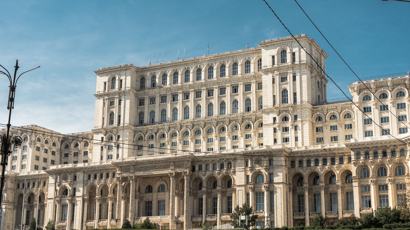 Capture of the iconic Palace of the Parliament in Bucharest, Romania under clear skies.