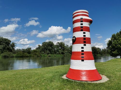 Free Vibrant striped sculpture near a river in Neustadt an der Donau, Germany. Stock Photo