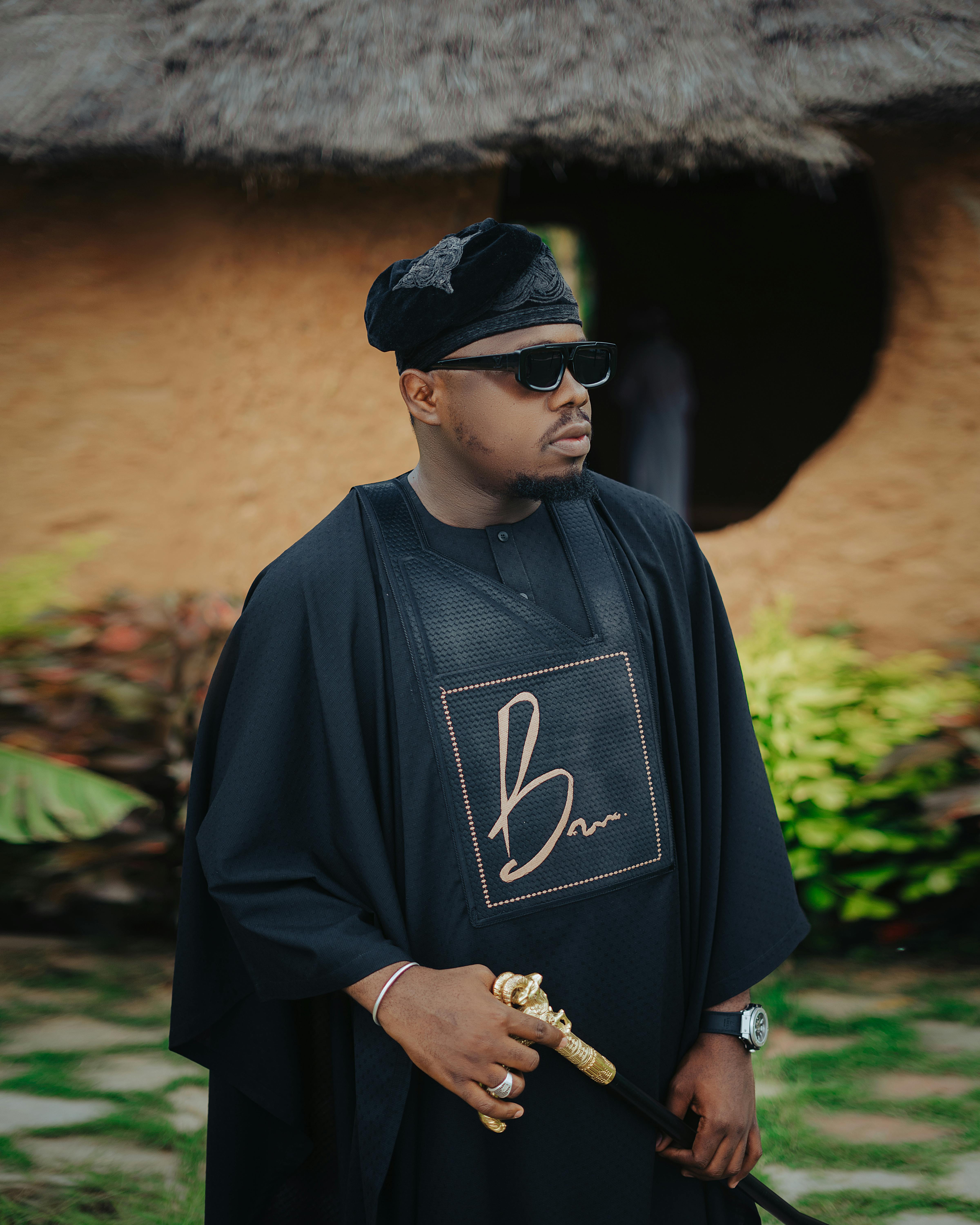 man dressed in traditional african attire outdoors