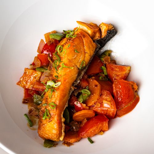 Free Grilled salmon fillet served with vibrant fresh vegetables, perfect for a healthy meal. Stock Photo
