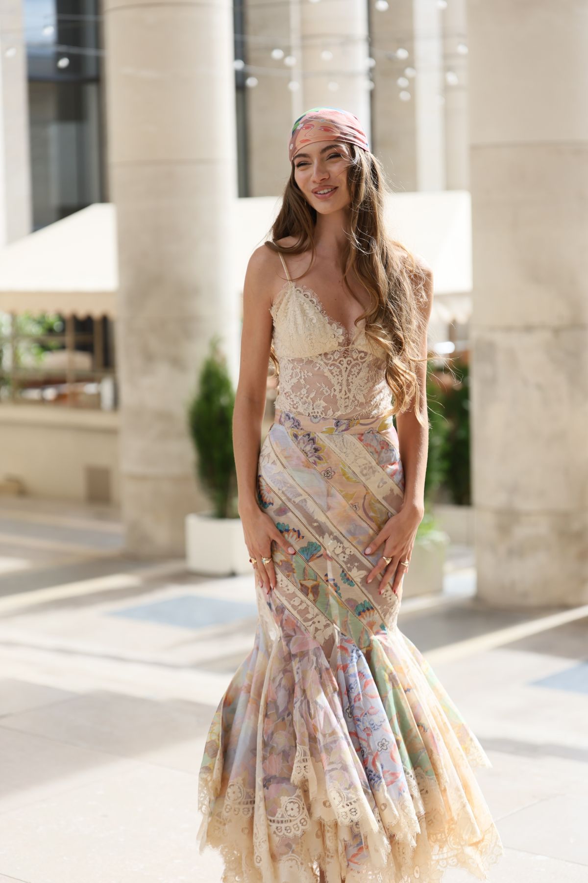 A young woman in an elegant summer dress in Paris