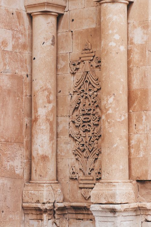 Free Close-up view of intricate stone carvings and architectural columns. Stock Photo