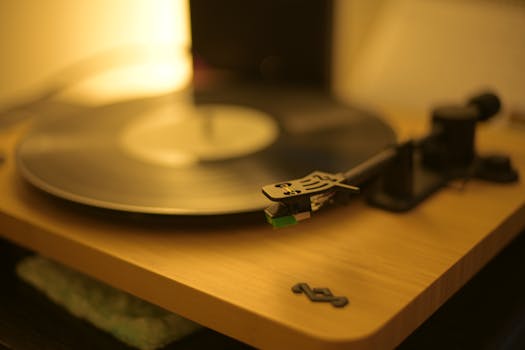 A close-up shot of a stylish vintage turntable playing a vinyl record.
