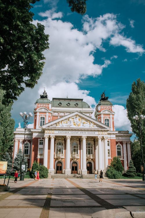 Free Beautiful view of the iconic Ivan Vazov National Theatre, Sofia, under a bright blue sky. Stock Photo