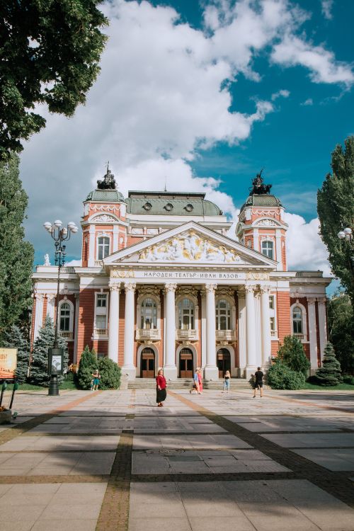 Free Historic theatre under a vibrant blue sky in Sofia, Bulgaria. Stock Photo