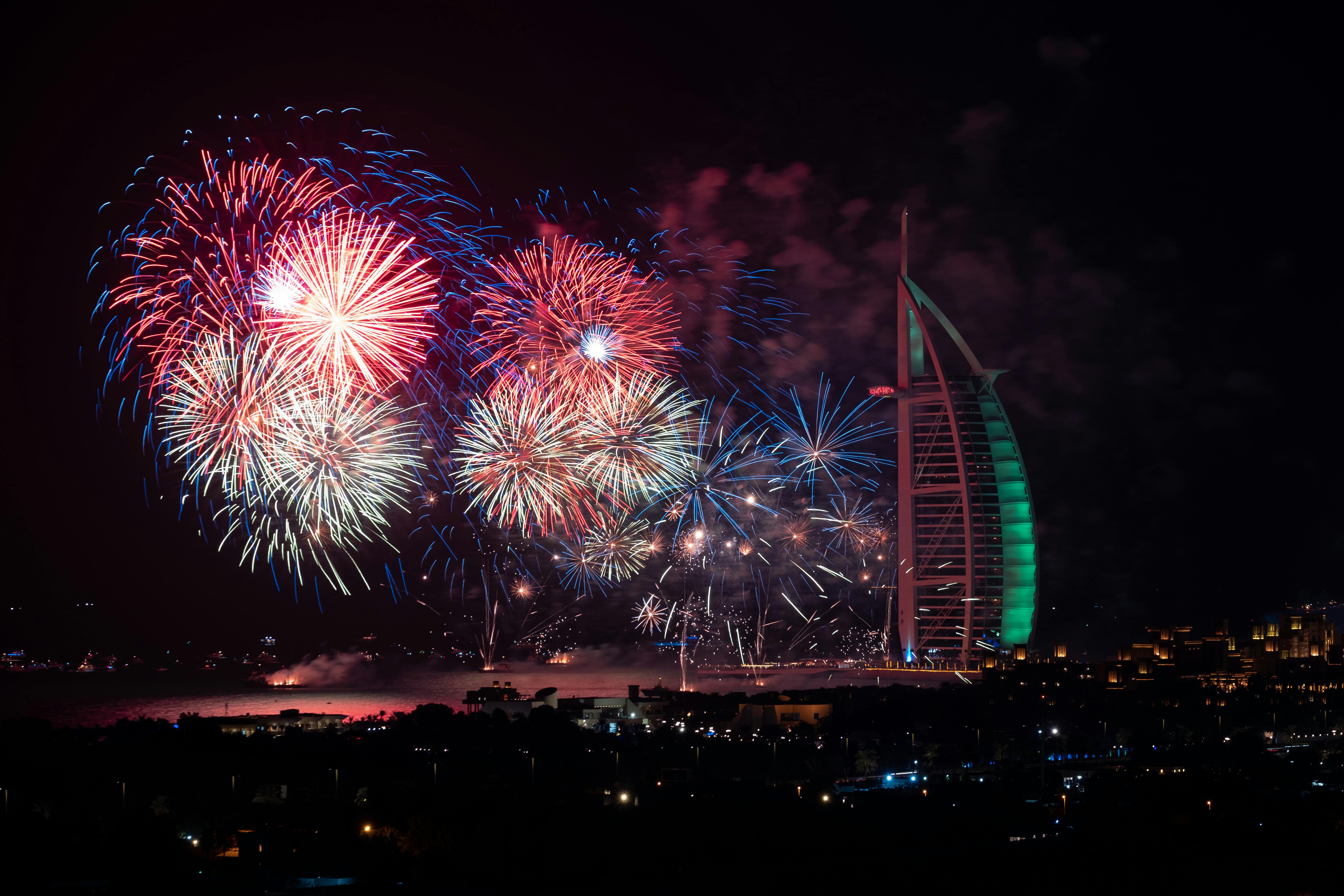 Colourful fireworks over Burj Al Arab at night